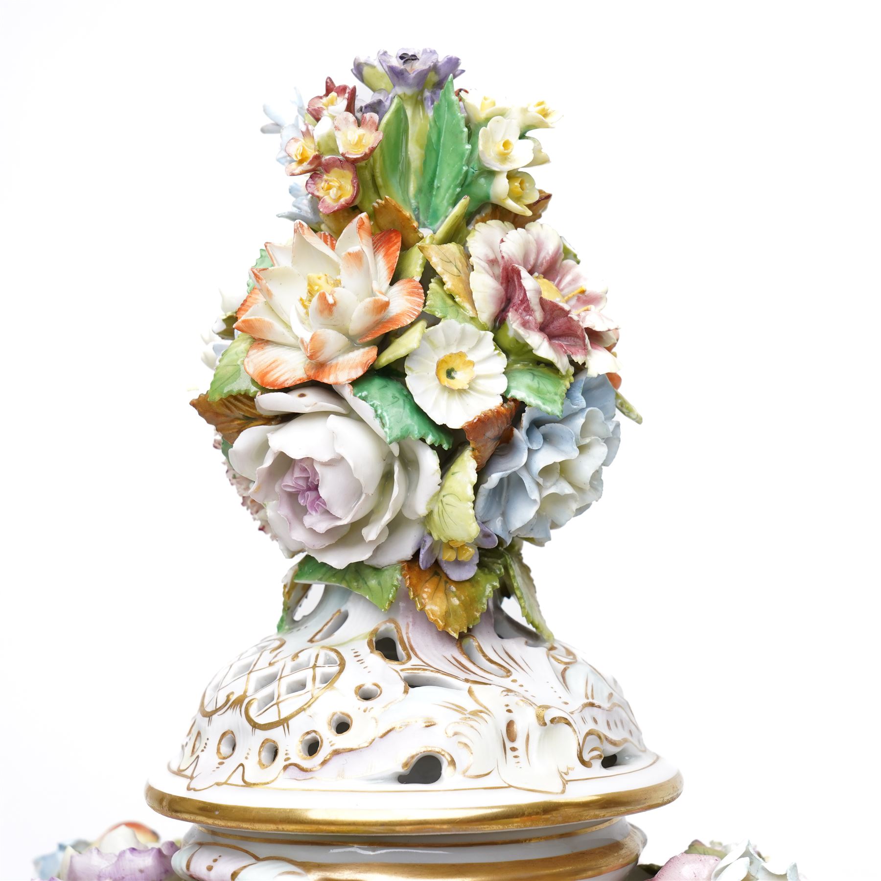 Pair of 19th century Potschappel porcelain two handled vases with covers and stands, painted with scenes of classical figures including Dionysus and Ariadne and with profusely applied flower heads on a scrolling field with gilt highlights H49cm (2)