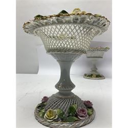 Pair of German Schierholz comports, with open weave baskets encrusted with roses, both with mark beneath, H15cm 