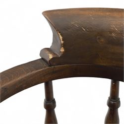 Early 20th century smokers bow armchair, shaped and curved top rail over turned spindles and open arms with rounded terminals, shaped elm seat on turned supports