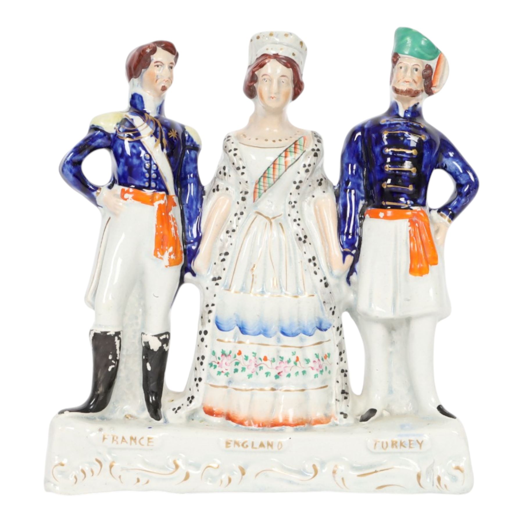 Rare mid 19th century Staffordshire figure group, Napoleon III, Victoria and Abdul-Medjid, made to commemorate the alliance of the three nations in the Crimean War, Victoria stands central with Napoleon in military uniform to her right, and the Sultan to her left, upon a titled base, H23.5cm