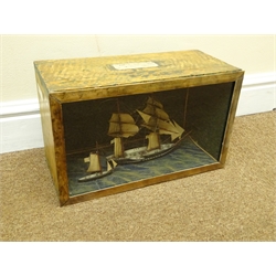  20th century naive Diorama of a twin masted whaler under full sail, with tender in glazed front case labelled 'Made by Capt. Fred Tibbetts' W39cm, H23cm, D18cm   