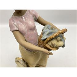 Lladro figure, Daily Chores, modelled as a lady holding a basket with a goose at her feet, Gres finish, sculpted by Marco Antonio Nogueron, with original box, no 12329, year issued 1995, year retired 1999, H34cm