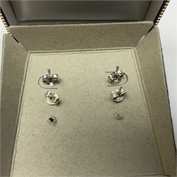 Pair of silver cubic zirconia flower cluster stud earrings and a pair of silver marcasite and pearl pendant stud earrings, both stamped 925