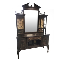 Late Victorian oak mirror back side cabinet, sloped arched pediment with dentil detail, the large rectangular mirror with bevelled edge, two astragal glazed display cabinets to each side, lower section fitted with drawer and cupboards, panelled doors with floral and ribbon carved mounts, blind fret work throughout, foliage carved supports, W154cm, H240cm, D51cm