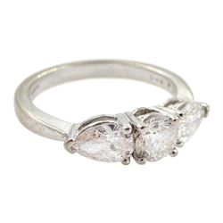 18ct white gold three stone diamond ring, central round brilliant cut diamond with two pear shaped diamonds either side, hallmarked, total diamond weight 1.48 carat