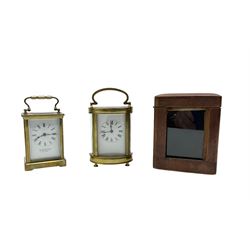 Two French early 20th century timepiece carriage clocks and a traveling case, both clocks ...