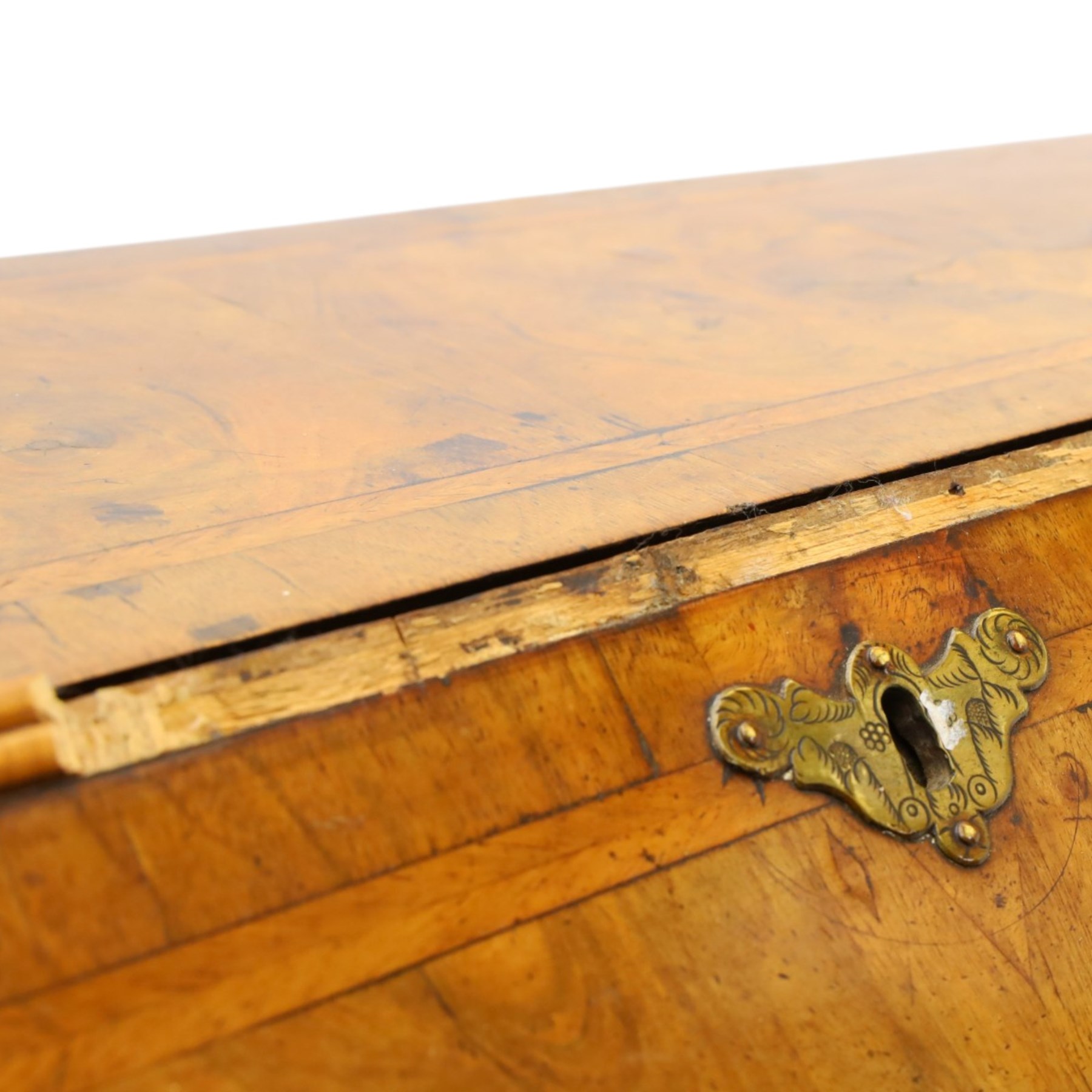 18th century figured walnut bureau, the sloped fall-front enclosing fitted interior with sliding base, pigeon-holes and correspondence drawers with shaped facias, over two short and two long feather-banded drawers with pressed brass handle plates, on bracket feet