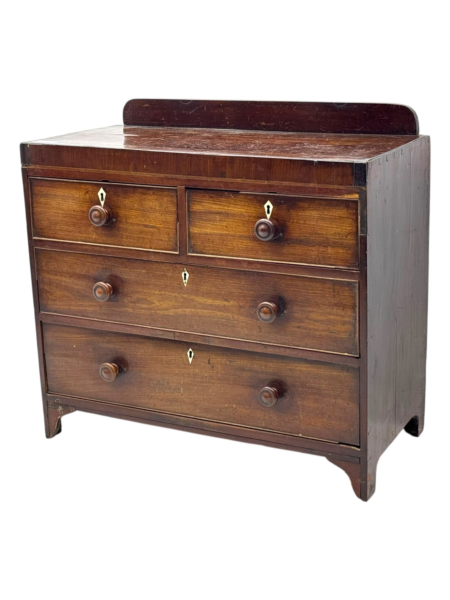 19th century mahogany chest, rectangular top with raised gallery back, fitted with two short and two long cockbeaded drawers, each with bone escutcheon, on shaped bracket feet