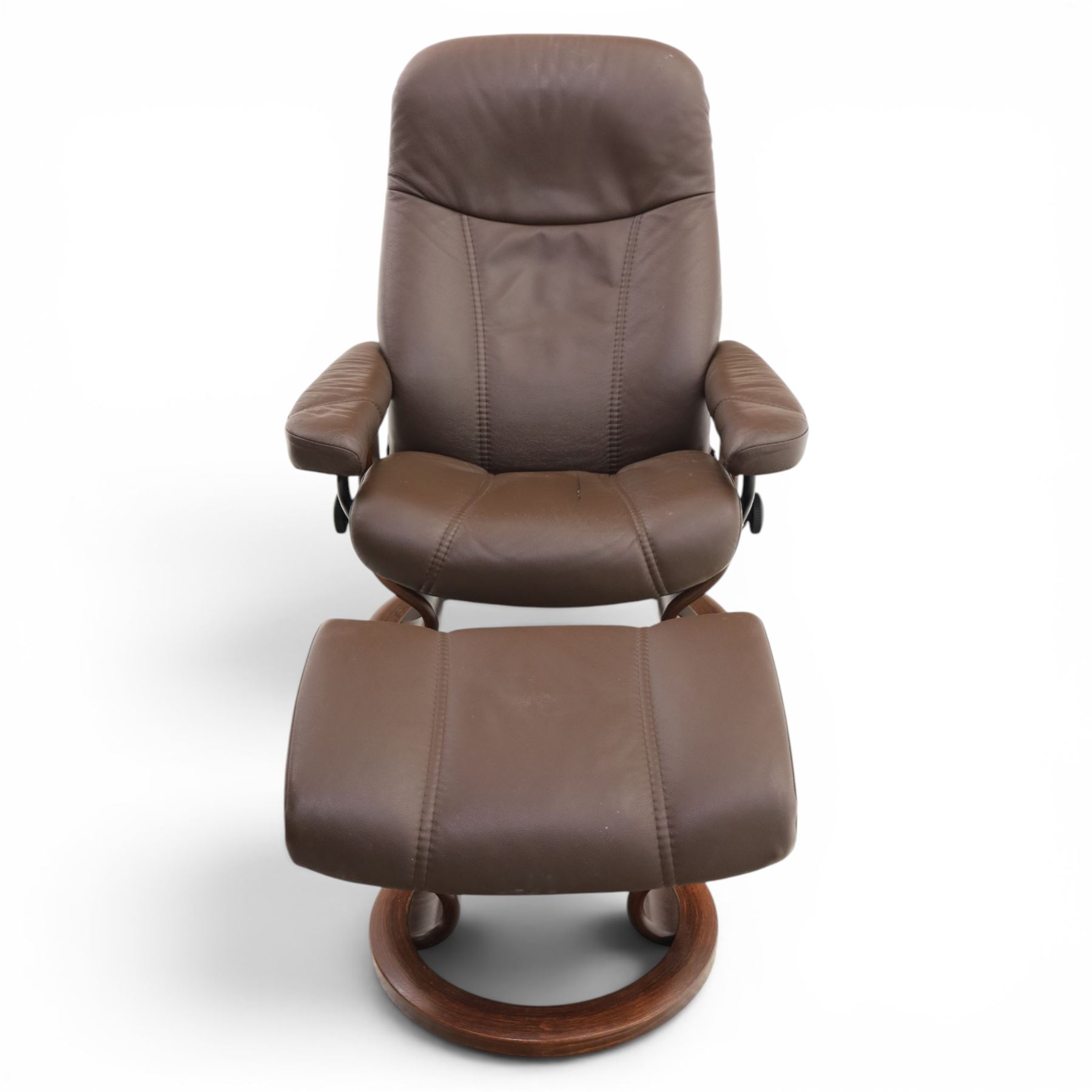 Ekornes - Stressless medium brown leather recliner swiveling armchair and stool, brown leather recline with stitching, together with a matching stool, on a round base