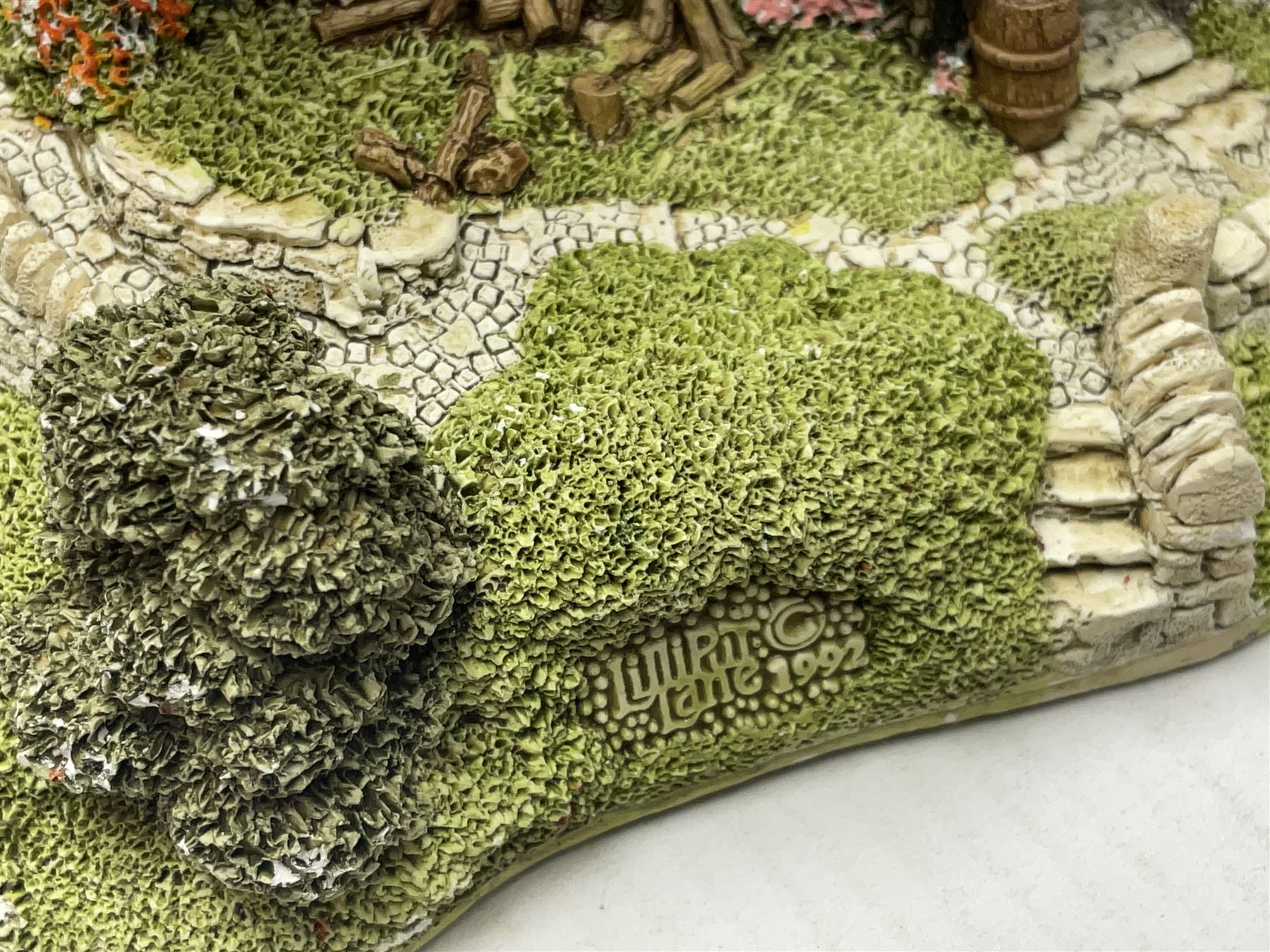 Three Lilliput lanes, comprising Oakwood Smithy, Anne of Cleves and Bluebell Farm, all with deeds and original boxes 