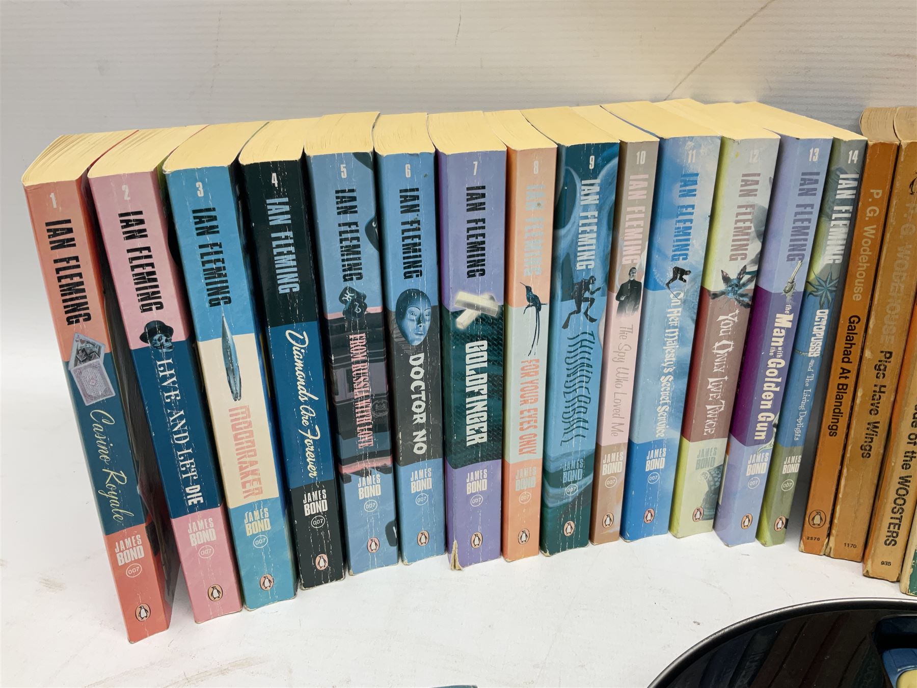 Wodehouse P.G.: Mr. Mulliner Speaking. First American edition 1930; eighteen P.G. Wodehouse paperback books; fourteen James Bond paperback books and Corgi tin of four James Bond die-cast model cars