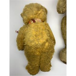 1950s English large wood wool filled teddy bear with swivel jointed head, glass type eyes and vertically stitched nose and mouth and jointed limbs with rexine paw pads H33
