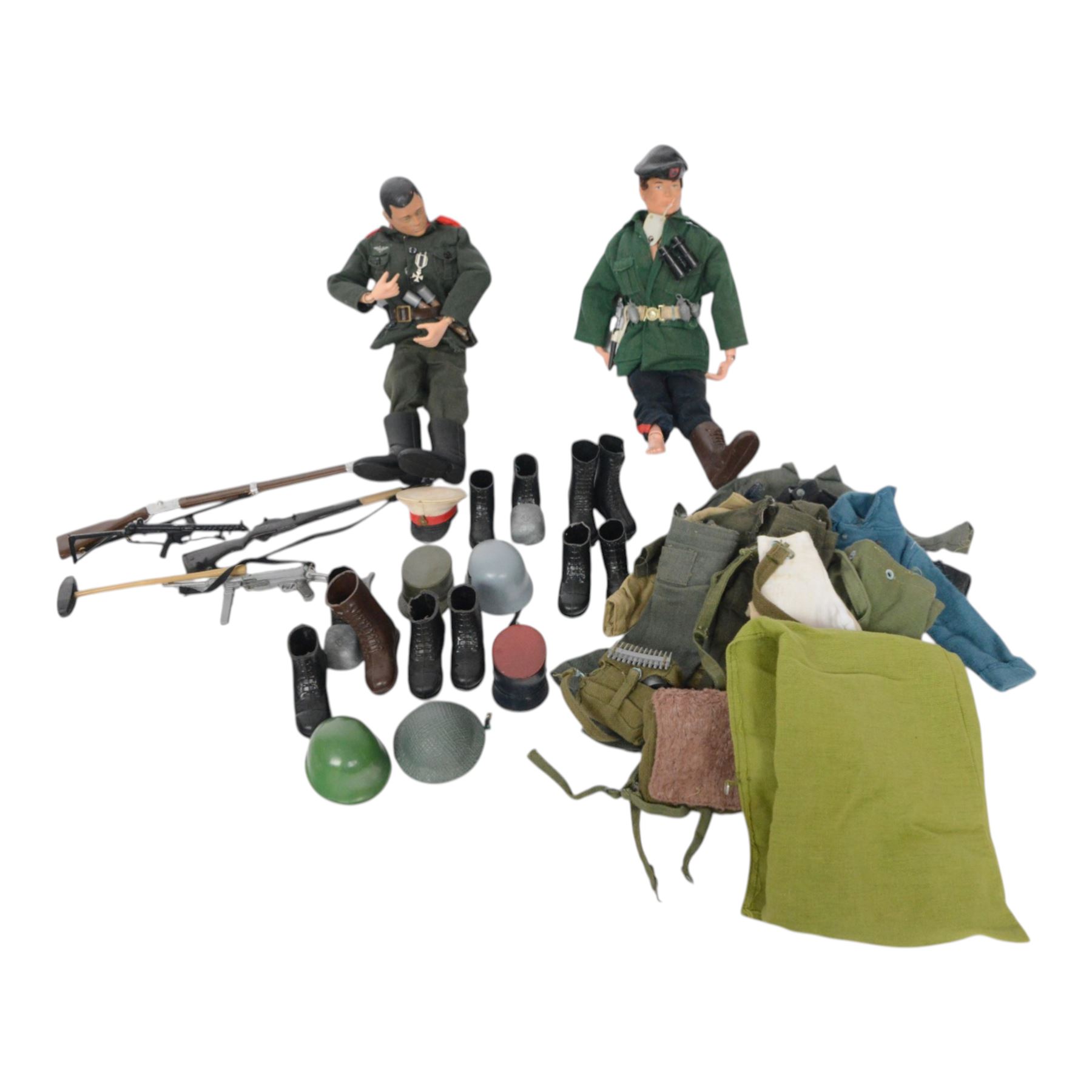 Two 1960s/70s Palitoy Action Man dolls, one with painted hair and one with flocked hair, both dressed in military uniform, together with a collection of mostly Palitoy/Hasbro Action Man clothing and accessories, including Special Operations Kit, Field Radio, weapons, shoes, helmets, clothing and other accessories