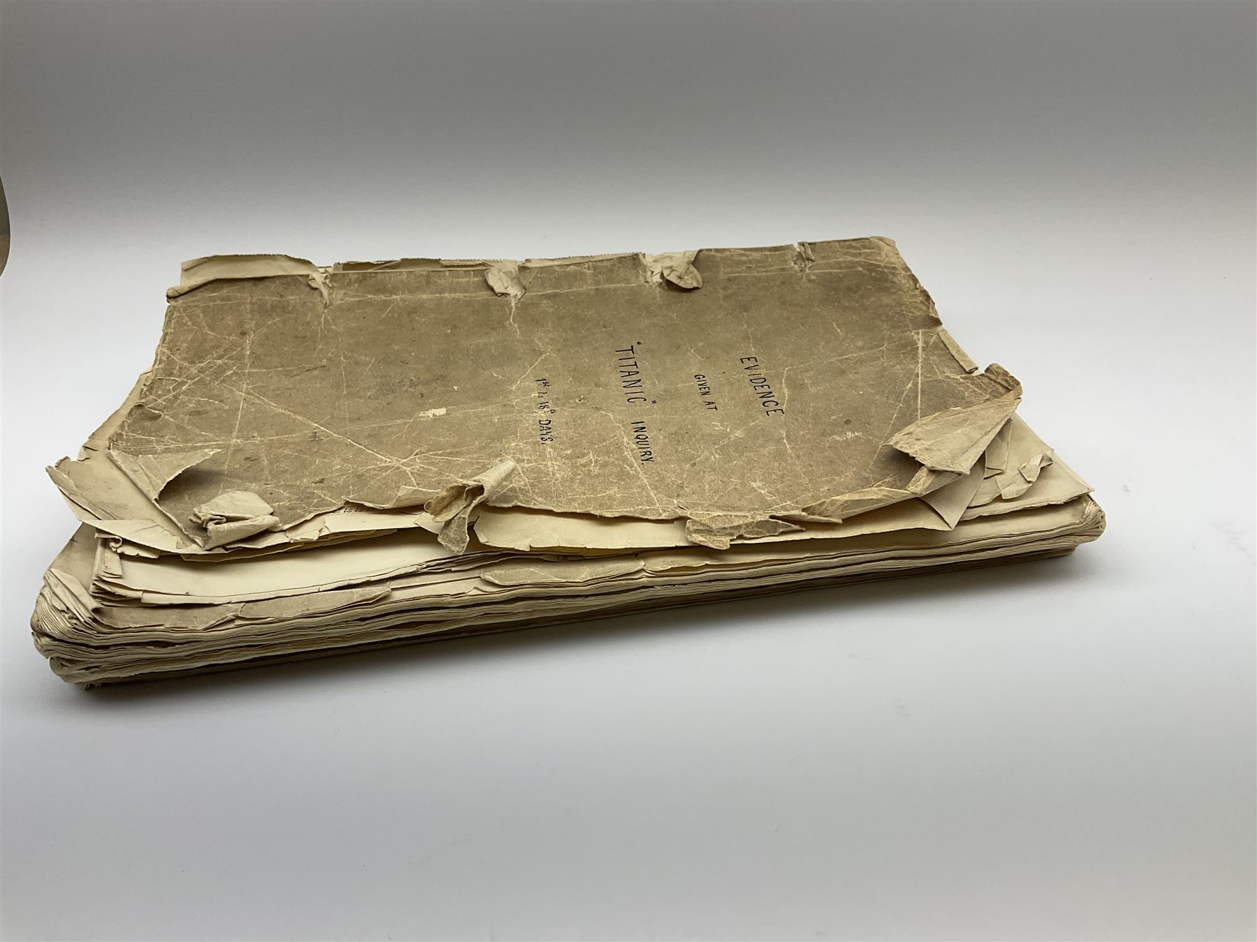 White Star line SS 'Titanic' - Proceedings Before The Right Hon. Lord Mersey, with Rear Admiral The Hon. S.A. Gough-Calthorpe C.V.O., R.N., et al. On a formal investigation ordered by the Board of Trade into the loss of the SS 'Titanic'. In the Wreck Commissioner's Court May/June 1912. Published by HMSO London. Unbound with hand written paper cover titled 'Evidence Given At 'Titanic' Inquiry 1st to 18th days. Incomplete - missing days 1 to 4 in list of witnesses, day 18 missing pp.503-506, appendix inserted between days 17 and 18. A rare and interesting part copy of the proceedings with unique annotations in many page margins. The first day title page is named in ink 'Mrs. Robinson', presumably Mrs. Annie Robinson First Class Stewardess and survivor, whose examination was on the eleventh day and which is partly highlighted in red pencil. The first eleven days also contain various pencil marginalia, hand unknown, together with a pencil cross-section drawing of the ship, with references to the pre-voyage fire and the engineers. The title pages of the twelfth day to the eighteenth day are all named in ink 'Mr. Boyle', referring to Alexander Boyle, with the twelfth day also bearing his professional stamp as 'Engineer Surveyor In Chief 23rd May 1912 Board of Trade'. No marginalia is found on days 12 to 18.