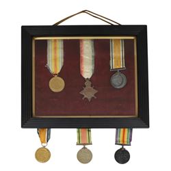 WWI medal trio; Victory medal, 1914/15 star and War medal, framed, together with WWI medal...