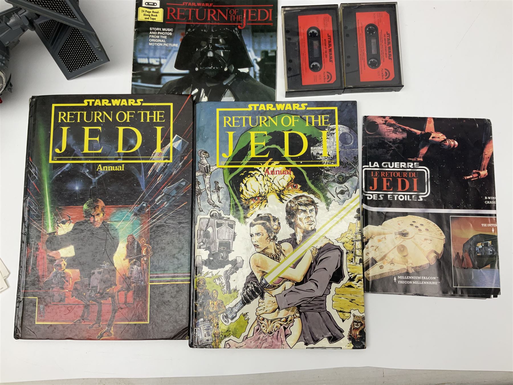 Star Wars - Darth Vader TIE-fighter; Darth Vader head and shoulder shaped figure collection box; 1983 & 1984 Return of the Jedi Annuals; Read Along Book and Tapes; and two posters