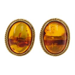 Pair of 9ct gold amber stud earrings, hallmarked