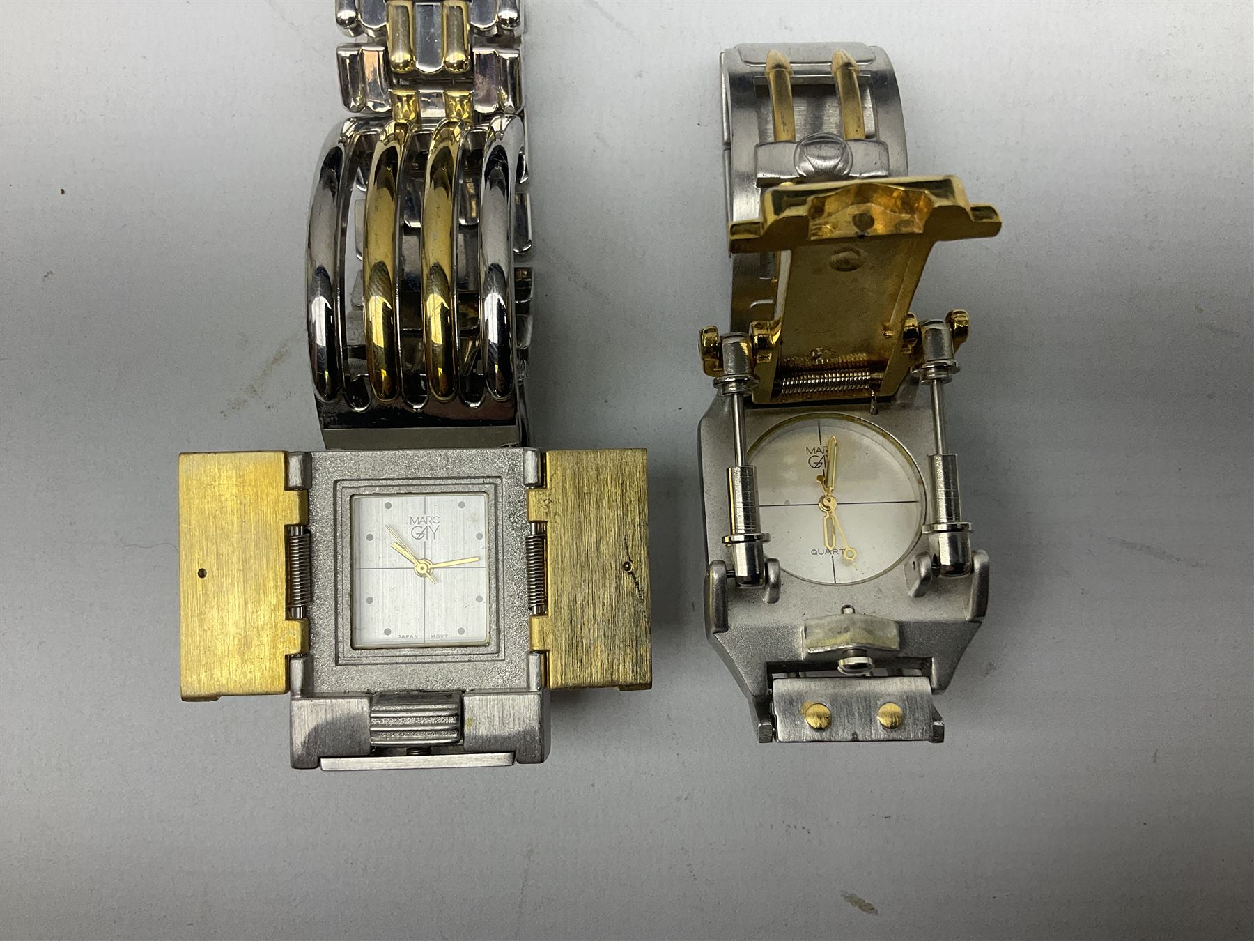 Four X Data stainless steel wristwatches, two Marc Gay wristwatches and one other, all with cover plates