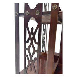Edwardian inlaid mahogany revolving bookcase, shaped square moulded top with central motif and satinwood band, two tiers with pierced vertical splats, on swivel action base with ceramic castors