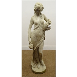  Composite garden statue of a part naked female carrying jugs, on circular base, H130cm    