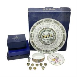 Royal Crown Derby trinket dishes, together with a number of paperweight stoppers and a Wedgwood calendar plate 