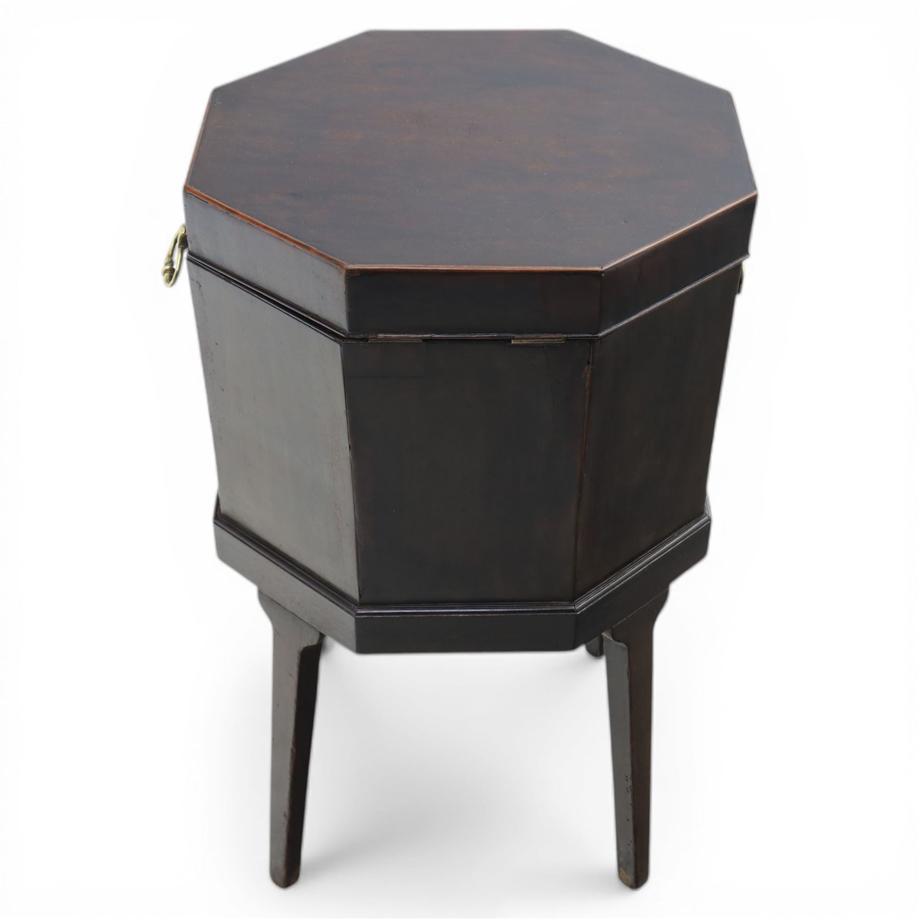 George III mahogany cellarette, of octagonal form with hinged top, brass handles and hinges, raised upon tapering supports