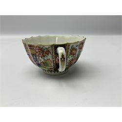 18th century Worcester teacup and saucer, circa 1770, of faceted form decorated in the Japanese Kakiemon style, similar to the Rich Queens pattern, with alternating panels of white formal chrysanthemums against a blue ground heightened with gilt, and flowering chrysanthemum plants and wheat sheaves, each with underglaze crescent mark beneath, teacup H4.5cm D8.5cm saucer D13.5cm