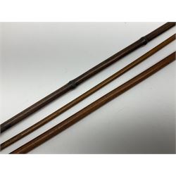 Early 20th century bamboo sword stick with 39cm oblong section blade L85cm overall; and two malacca cane swagger sticks, one with white metal mounts the other with yellow metal mounts (3)