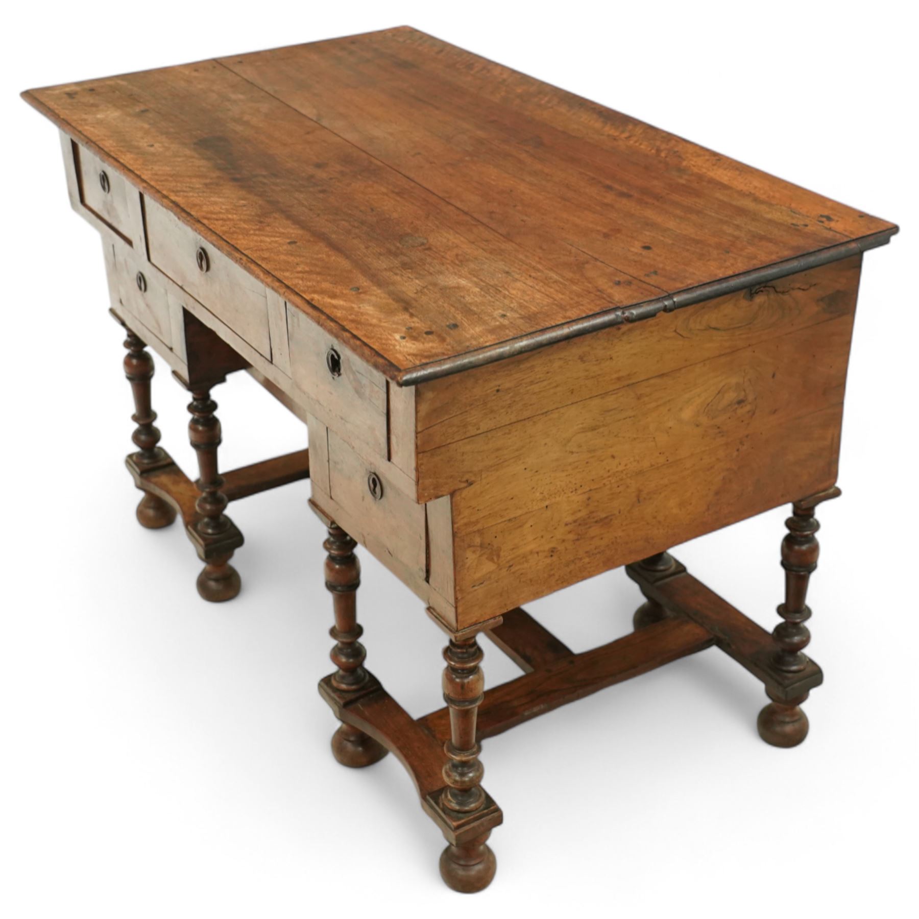 19th-century Louis XIV design French walnut bureau Mazarin, rectangular top above central drawer and recessed drawer flanked by two rows of small drawers,  supported on baluster turned legs united by an H-form stretcher, raised on bun feet 