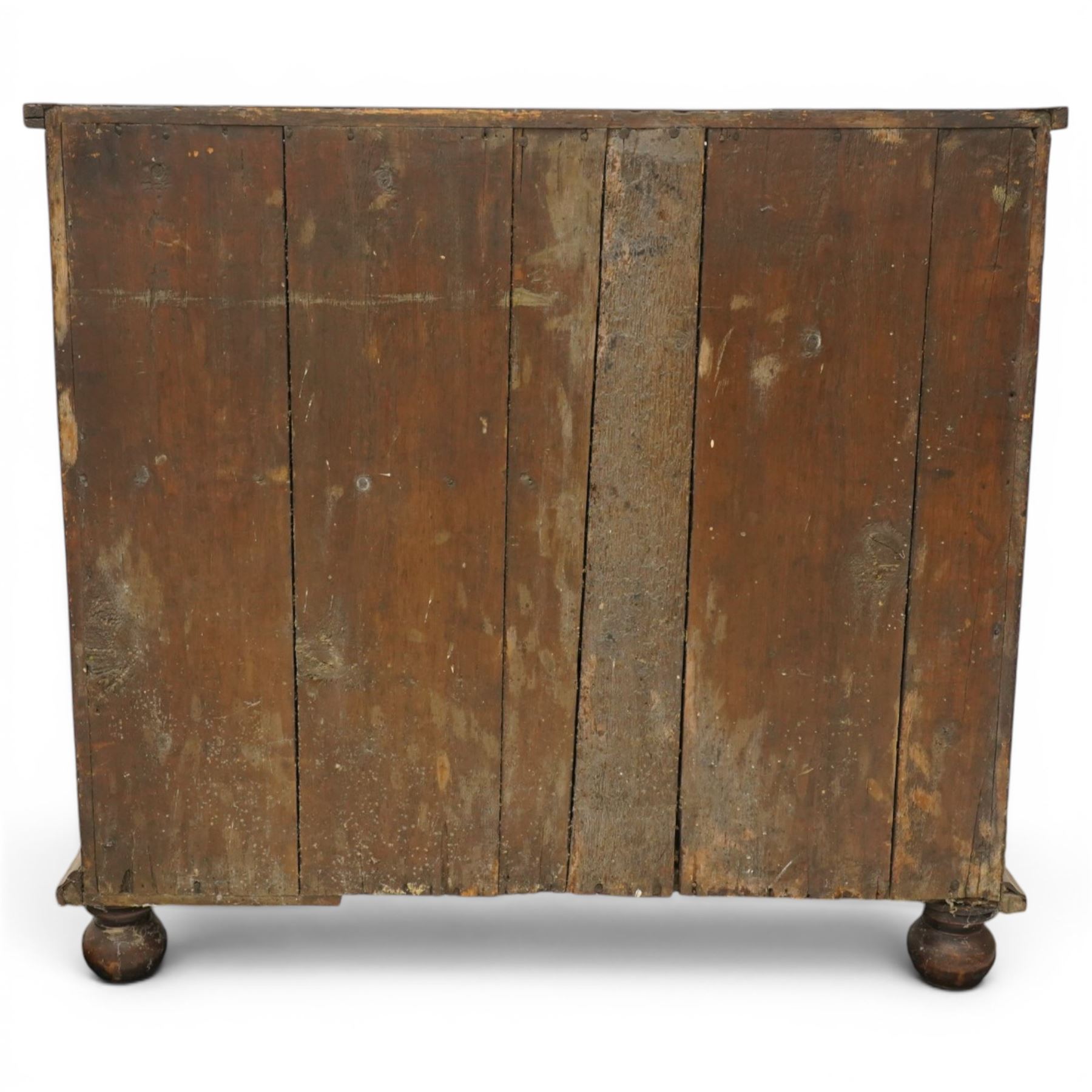 William & Mary period laburnum and walnut oyster-veneered chest, the rectangular top with canted corners and walnut banded edge, profusely decorated with oyster veneer and fruitwood stringing in concentric circles, fitted with two short over three long drawers with fruitwood banding, each fitted with original pressed brass escutcheons and pull handles, lower moulded edge over original bun feet