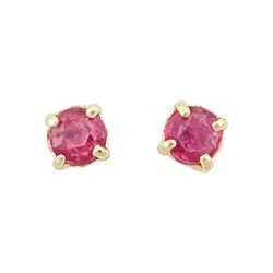 Pair of 9ct gold round cut ruby stud earrings, stamped