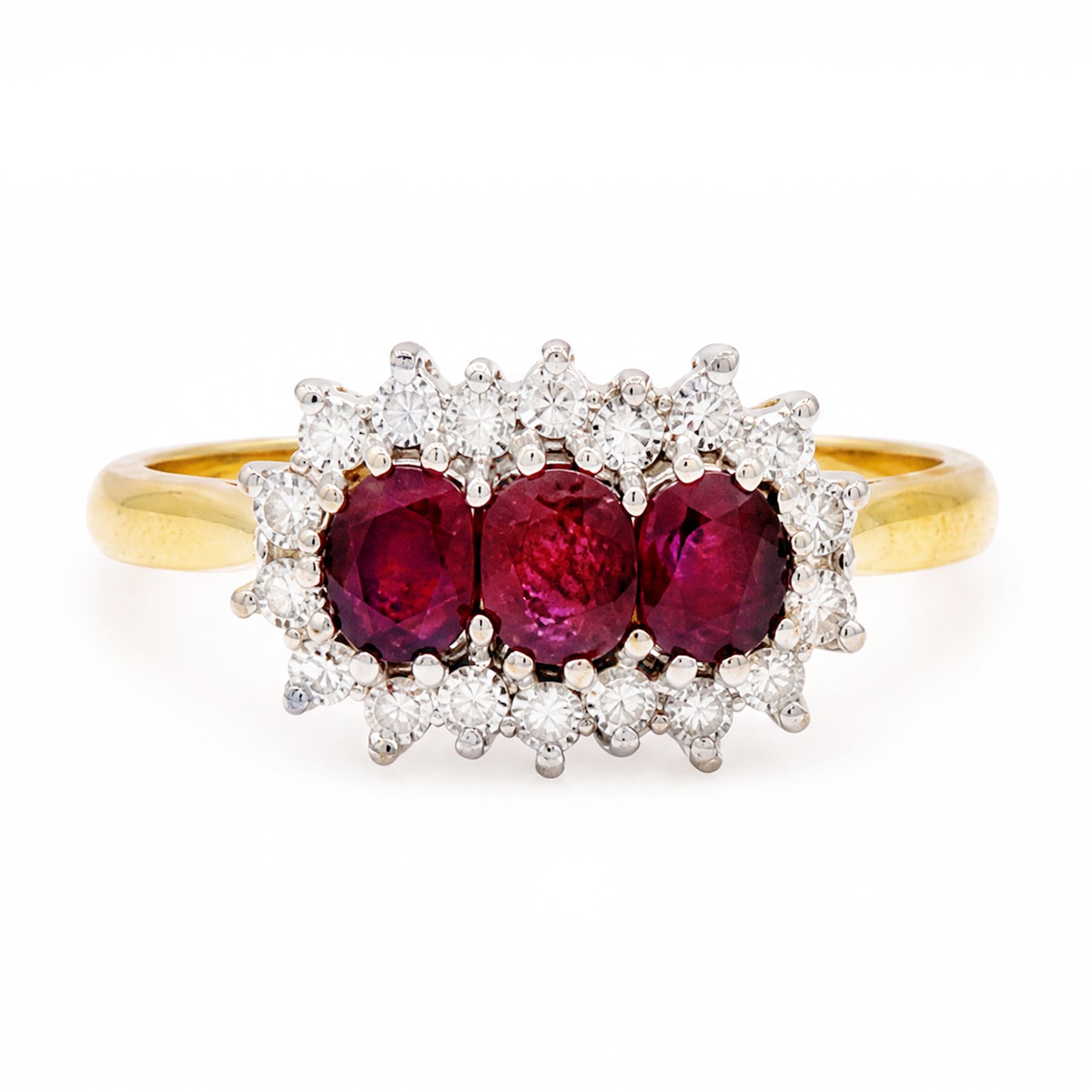 18ct gold ruby and diamond cluster ring, three oval cut rubies surrounded by eighteen single cut diamonds, London 1979, total ruby weight approx 0.55 carat, total diamond weight approx 0.20 carat