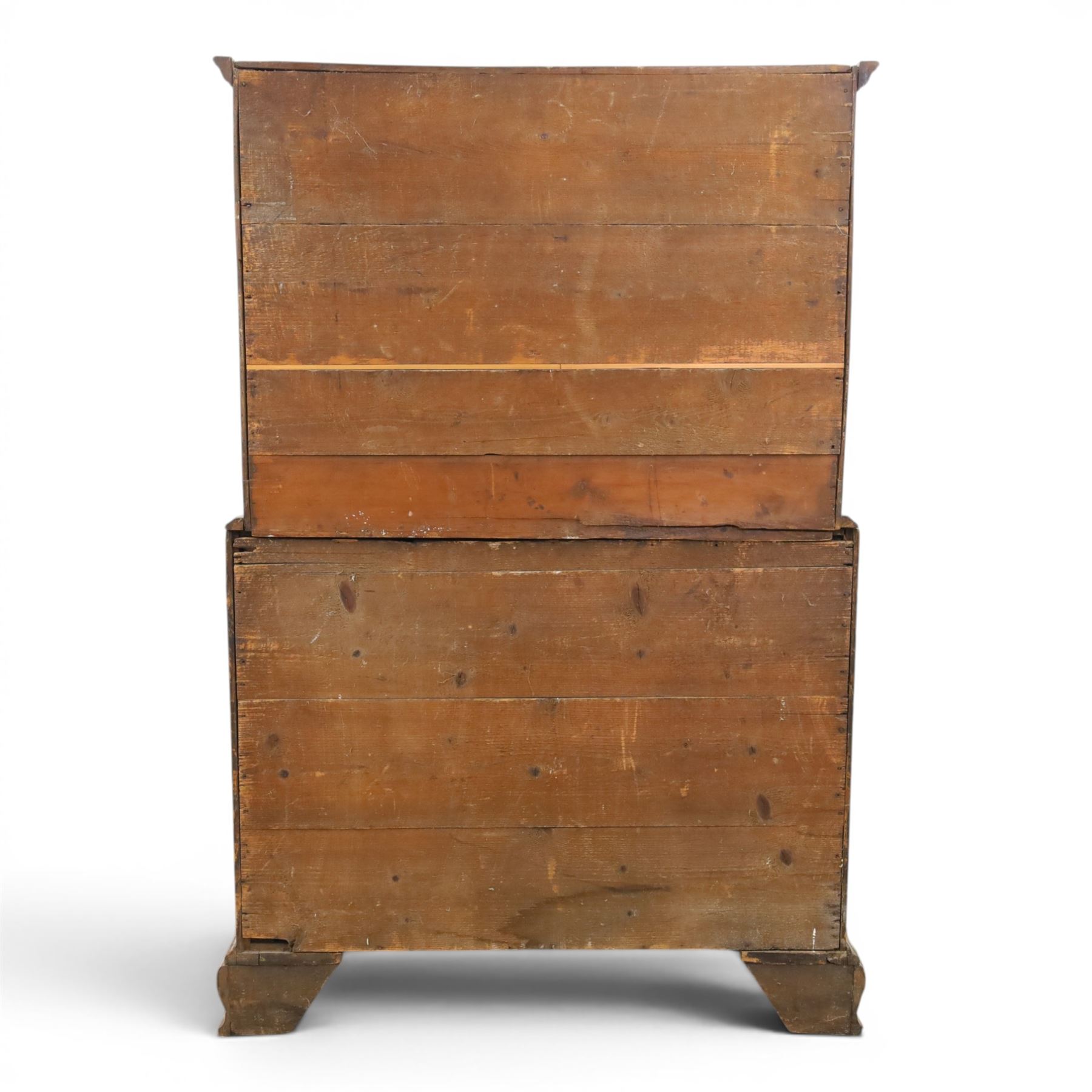 George III mahogany chest on chest, moulded cornice over two short over two long drawers with figured mahogany veneers, lower section fitted with three further long drawers, oval brass plate handles and escutcheons, on shaped bracket feet