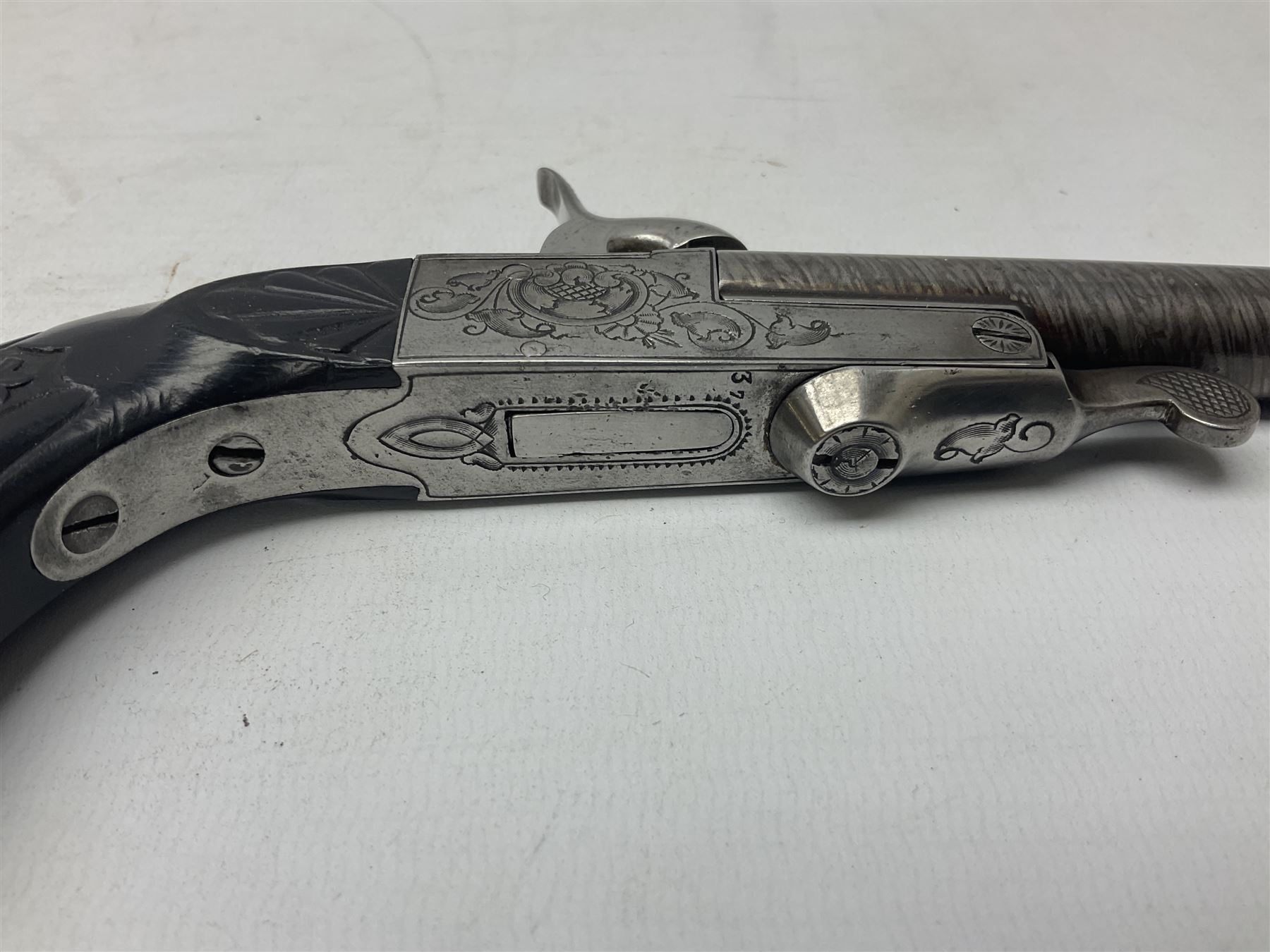 Mid-19th century French Boissy 12mm single barrel pin-fire pistol, the 9.5cm rifled barrel with brown stub twist damascus decoration, side screw under lever opening and English proof marks, retailed by H. Akrill Beverley, chased action with drop-down trigger and carved walnut stock L21cm