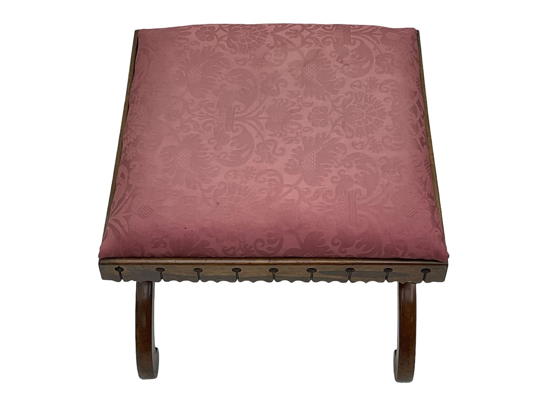 20th century mahogany rectangular footstool, needlework upholstered drop-in seat, on ball and claw carved feet (W81cm, D35cm, H34cm); 19th century elm stool, needlework upholstered drop-in seat, on square moulded supports united by plain stretchers (W45cm); 19th century walnut stool, shaped top upholstered in needlework, on cabriole supports (W50cm); 19th century rosewood stool, upholstered drop-in seat, on curved x-framed supports united by turned stretcher (W47cm)