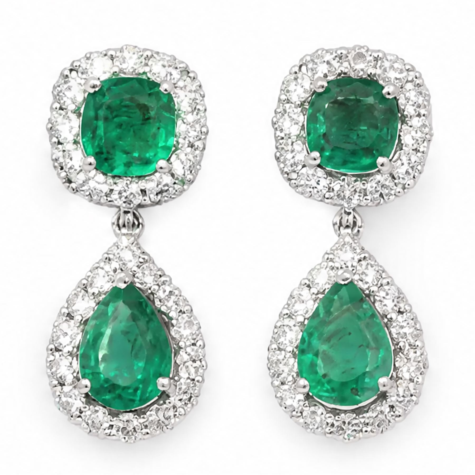 Pair of 18ct white gold emerald and diamond pendant earrings, each stud set with a cushion cut emerald and round brilliant cut diamond surround, suspending a further pear cut emerald and diamond cluster stamped, total emerald weight approx 3.45 carat, total diamond weight approx 1.70 carat