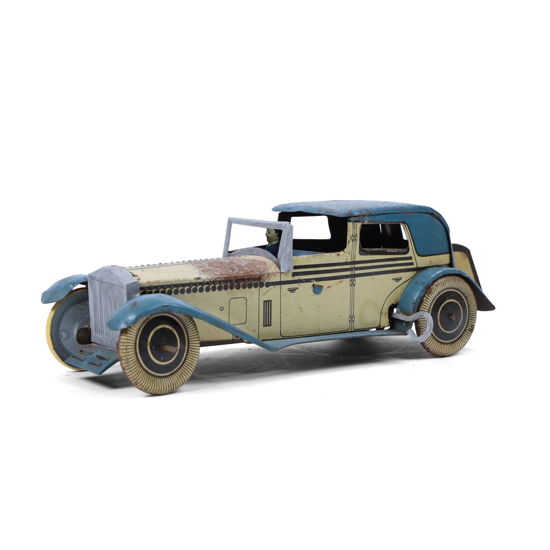 Wells tinplate clockwork limousine, the cream body, with blue roof and lithographed details, with driver and key, H8cm, L23cm