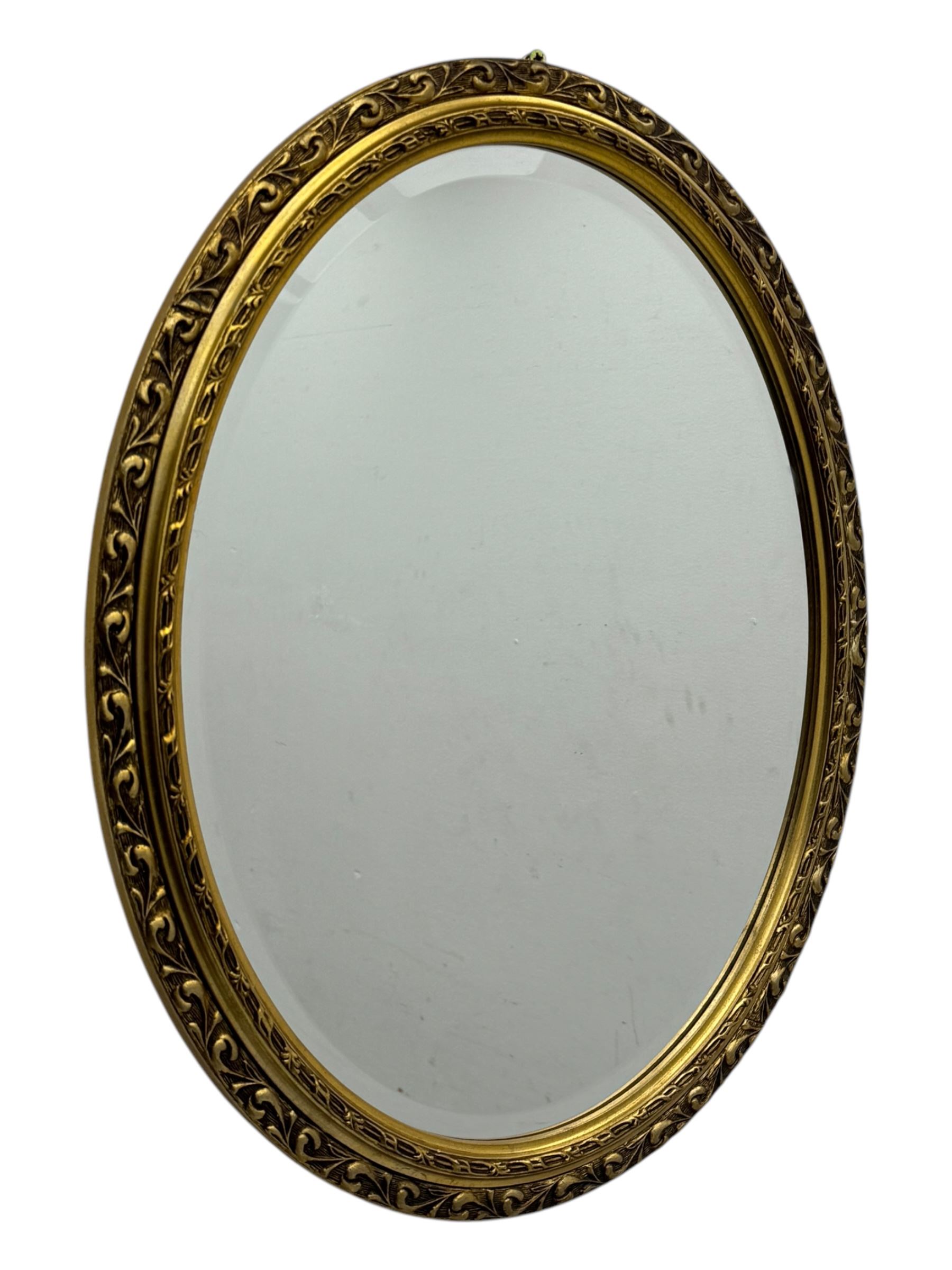 Four decorative mirrors, including gold-toned triptych dressing mirror with foliate borders, two rectangular framed mirrors and a circular gilt mirror with ornate edging