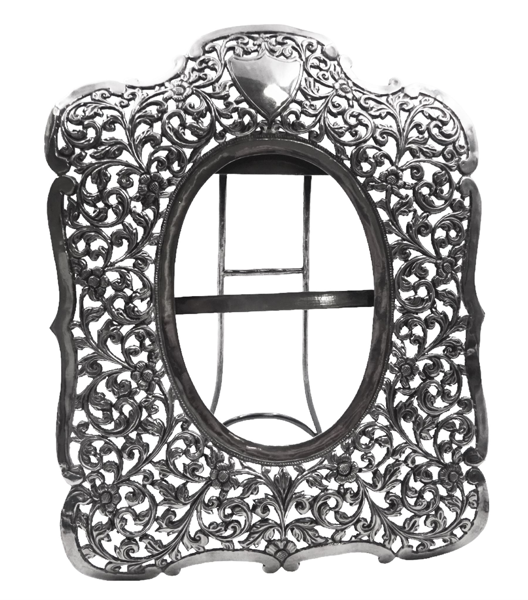 Continental silver photograph frame, probably Austrian, with pierced foliate and scroll decoration and vacant shield cartouche, H24.5cm, W19cm, approximate total weight 10.8 ozt (336.6 grams)