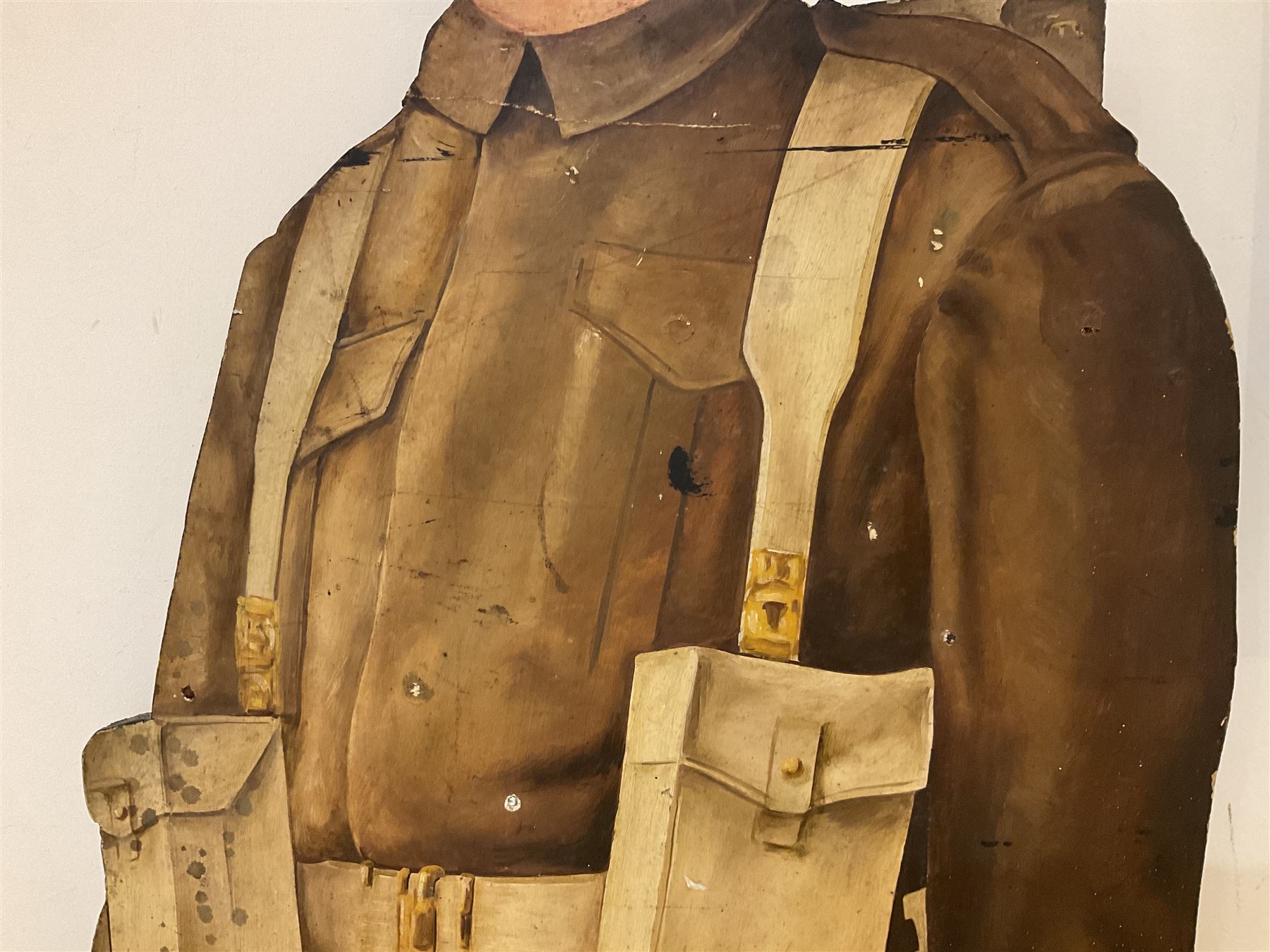 Military Outfitters hand painted life size wooden cut out figure of a WW1 soldier standing at ease holding a gun by his side, marked Stening Signs; hardboard on planked frame H199cm