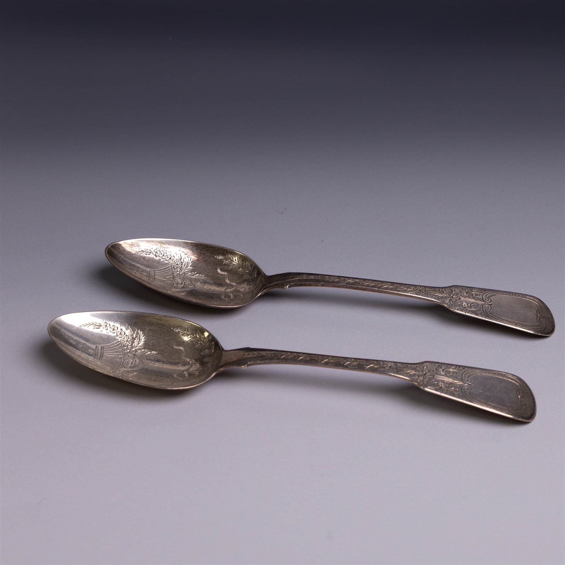 Pair of George III silver Fiddle pattern table spoons, each with bright cut floral and foliate decoration, hallmarked Sarah & John William Blake, London 1815