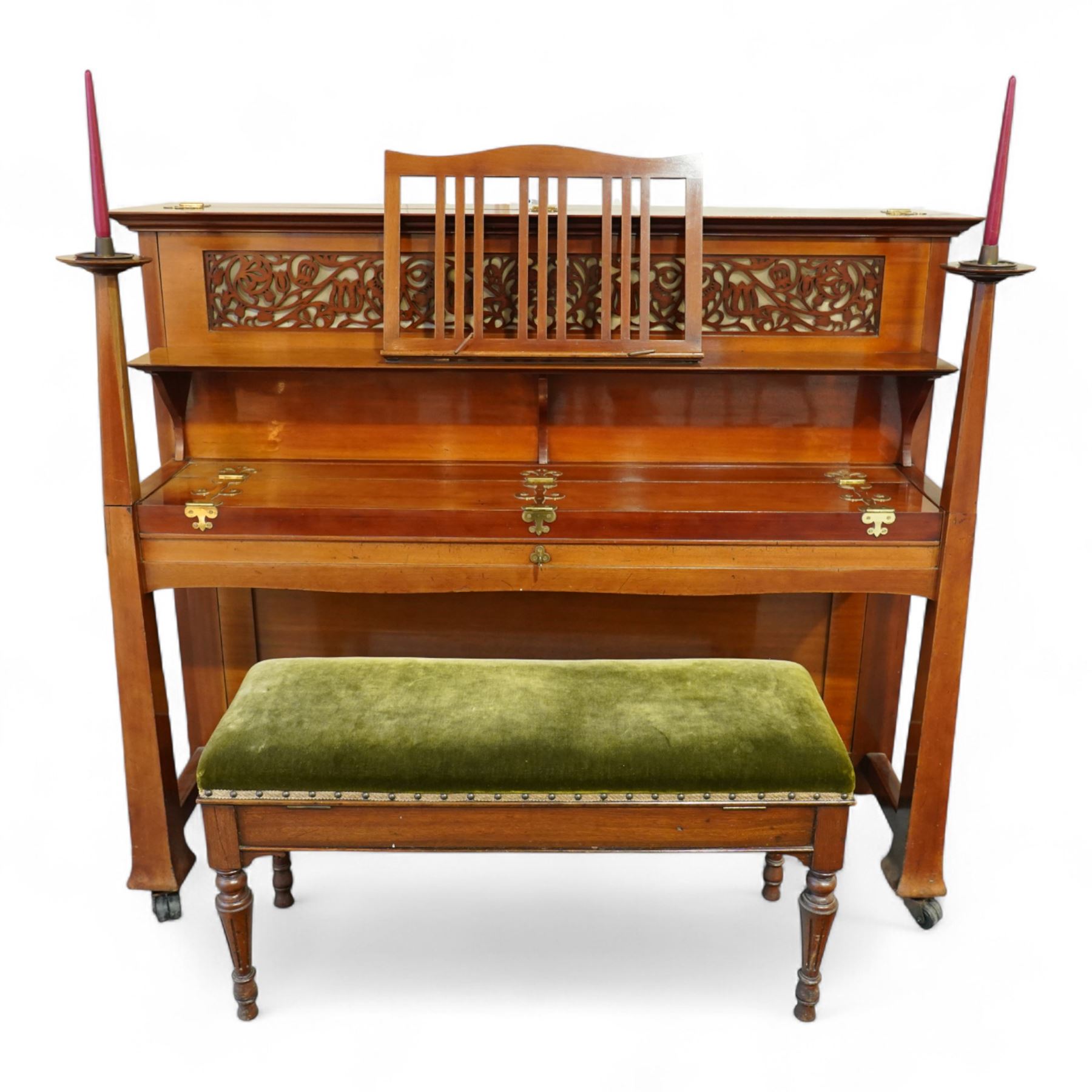 Claud Bechstein- German model IV overstrung upright piano in a mahogany Arts & Crafts designed case by Walter Cave, Serial number 56589 (1900-01), with a lattice music desk and silk backed open fretwork, square key fall with makers name and crafted brass hinges, two candle sconces on tapered square supports, makers name and model number cast into the frame, with an underdamper action, una-corda and sustain pedals, recently re-strung with new tuning pins, responsive action and damping, in very good playing condition, with 85 ivory and ebony keys A0-A7, tuning A=440. Including a period duet stool with a velvet-padded top.
Walter Cave was a leading architect, interior designer, and furniture maker during the Arts & Crafts period, a similar piano to this was owned and played by George Bernard Shaw and is on exhibition at the National Trust property, Shaw's Corner (Hertfordshire).

This item has been registered for sale under section 10 of the APHA Ivory Act, Reference 8P3C9UKA
