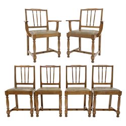 'Acornman' set six oak dining chairs, shaped cresting rail over triple turned spindle back, turned front supports connected by H stretcher carved with the acorn signature, two carvers and four side chairs, by Alan Grainger of Brandsby, York