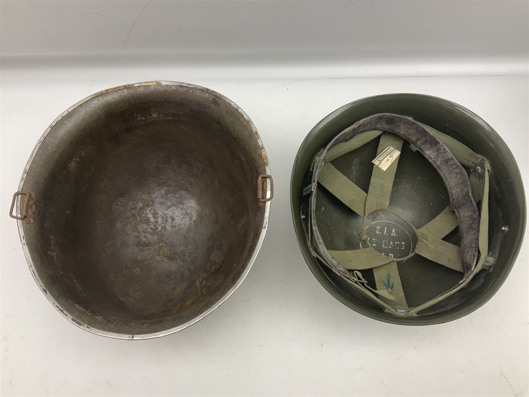 1950s French Algerian War steel helmet with liner; indistinctly marked 'S.I.A. LE EANS(?) 71R'