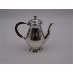 Liberty & Co 1930s small silver coffee pot, of plain baluster form, with brown Bakelite C handle with trefid mounts and cover with spherical knopped finial, upon circular stepped foot, hallmarked Liberty & Co, Birmingham 1934