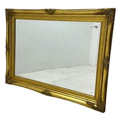 Gilt framed wall mirror, moulded frame decorated with foliate cartouches, bevelled mirror plate 