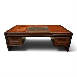 Dyrlund - Santos rosewood office suite, comprising an executive desk and cream leather upholstered swivel chair, the desk with a broad rectangular top with rounded corners, leather writing surface, pen compartments and letter tray, three lockable frieze drawers with fitted interiors above a central kneehole flanked by floating drawer pedestals, the left housing a filing drawer and the right three compartmented drawers, with a full width modesty panel to the reverse, chair raised on a castor base, H 116cm, W 62cm, D 74cm