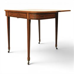 Regency mahogany fold-over tea table, rounded rectangular top with gateleg action, inlaid and crossbanded frieze, raised on squared tapering supports on brass castors