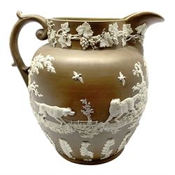 Large 19th century Jasperware jug, of exhibition size, probably Wedgwood or Copeland Spode, the brown ground decorated with hunting scene frieze of hounds chasing game birds and rabbit, the base and and scrolling handle with foliate detail, the rim with fruiting vine, H35cm