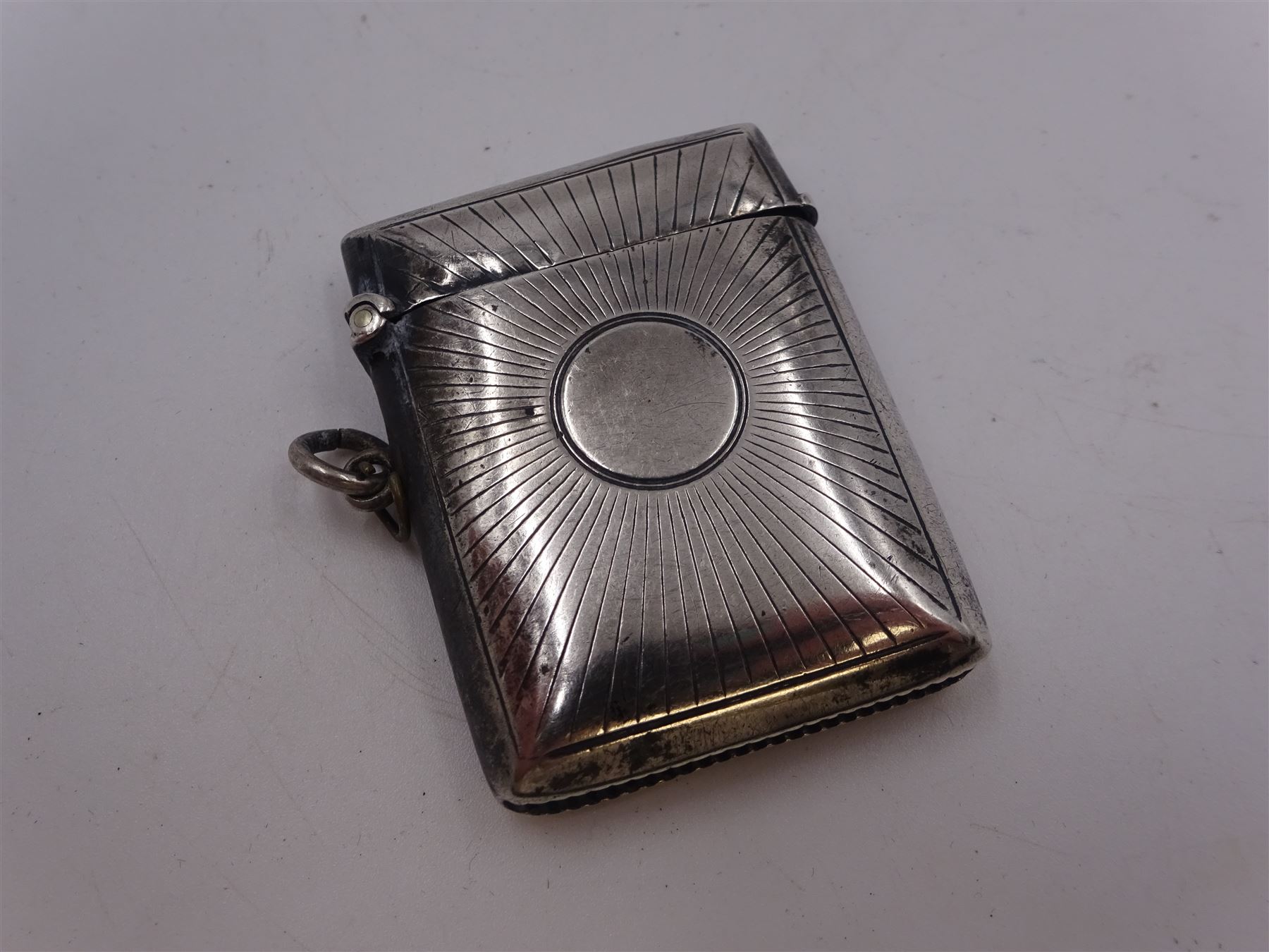 Five Victorian and later silver vesta cases, including Edwardian example with engraved sunburst decoration, hallmarked Abrahall & Bint, Birmingham 1905, and an early 20th century example with engraved foliate decoration and pull-out match compartment, hallmarked Sydney & Co, Birmingham 1910